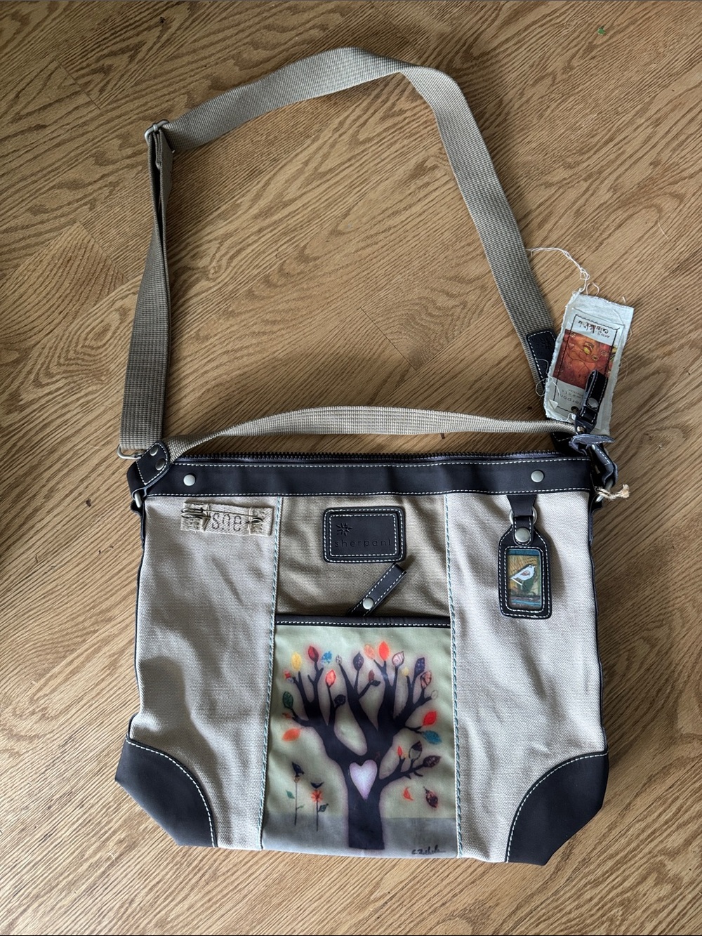 Sherpani Tan and Black Canvas Messenger Bag with Tree Artwork NWT